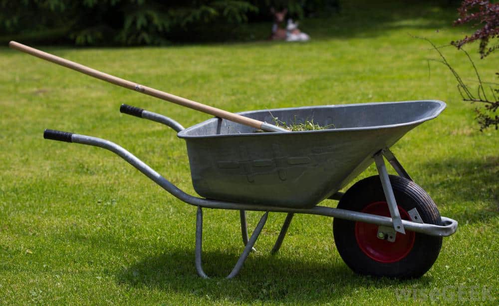 Gardening tools - image of a wheelbarrow and rake Perth garden