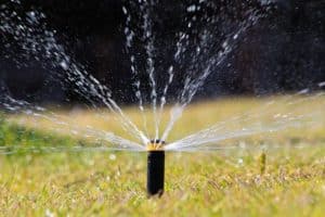close up details of automatic lawn pop-up sprinkler